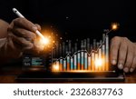 Small photo of Businessman analyzing business Enterprise Data Management Business analytics with charts, metrics and KPIs to improve organizational performance, marketing, corporate strategy.