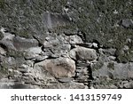 Small photo of Lovely rustic stone tile and concrete wall photographed in Madeira, Portugal. The wall is grey colored and looks very weathered and old. Anyhow, it's having an interesting texture- perfect background!