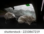 Small photo of Two deflated Airbags in a car after a traffic accident