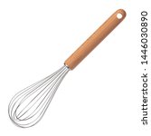 Small photo of Clean new steel whisk isolated on white background. Cooking egg beater mixer whisker with wooden handle.