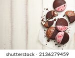 Small photo of American whoopie pie desserts on white wooden planks