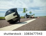 Biker Helmet Lies On Street...