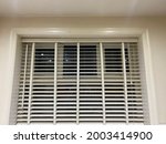 Small photo of A lovely set of wooden blinds finished in white paint, very high quality made in England with a gorgeous border to emphasise the look