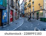 Small photo of PAMPLONA, Spain - July 07 2022: The streets of Pamplona, ​​in the morning, after the end of the first day of San Fermin. Garbage thrown on the street, unbearable smell. Deplorable aspect of the city