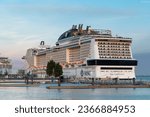 Small photo of Lisbon, Portugal - October 09, 2022: Promenade and port area in Lisbon. Large cruise ships docked in the port terminal. People walking on the promenade and taking pictures of the cruise. MSN Virtuosa