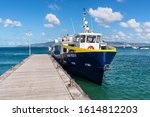 Small photo of Les Trois-Ilets, Martinique - December 13, 2018: Passenger boat Anse Bleue with tourists at the pier in the Anse-a-l'Ane Bay, France's Caribbean overseas department of Martinique.