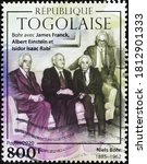 Small photo of Milan, Italy - August 01, 2020: Niels Bohr with Einstein and other scientists on stamp