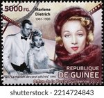 Small photo of Milan, Italy - September 22, 2022: Marlene Dietrich and Gary Cooper on postage stamp