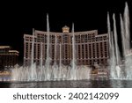 Small photo of Las Vegas, Nevada, USA - 2 April 2017 - Fountains of Bellagio. Fountains at Bellagio Hotel and Casino in Las Vegas. Bellagio fountain water show at night. Bellagio hotel and the dancing fountains.