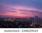 Small photo of Gurgaon,Haryana,India-August 20,2021:Colorful sunset in urban city skyline.Residential apartment,commercial hub with modern architecture,monsoon clouds.Cityscape,city lights in Delhi NCR business hub