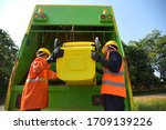Small photo of Garbage collector Worker of urban municipal recycling garbage collector truck loading waste and trash bin