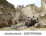 Small photo of Mogadishu, Somalia - September 28, 2011 - Fishermen resting at the end of a busy working day.