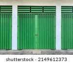 Closed steel rolling door with green color