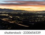 Los Angeles California dawn view above Chatsworth and the 118 freeway in the west San Fernando Valley.  The San Gabriel Mountains and Burbank are in the distance.  
