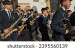 Small photo of Utrera, Andalucia 26th November 2023 - the brass section of a marching band entering the town square prior to a performance to celebrate St Cecilia's Day - patron saint of music