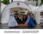 Small photo of MOSCOW, RUSSIA - MAY 30, 2019: Azerbaijan Festival. Two women in ethnic dress dancing traditional azeri dance at street. Traditional, folk, celebration concept