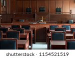 Small photo of Table and chair in the courtroom of the judiciary.