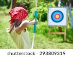 Girl with bow shooting to sport aim in sunny summer day