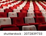 Marked seats in the audience of the theater hall during the pandemic.