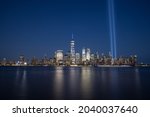 The Tribute in Light installation and One World Trade Center are seen over lower Manhattan on the 20th anniversary of the September 11 attacks, from Jersey City 9-11 Memorial site, September 11, 2021.
