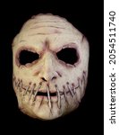 Small photo of Serial Killer Mask with a Broad Mouth Sewn Shut Isolated Against Black Background