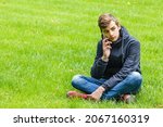 male student talking on a phone ... | Shutterstock . vector #2067160319