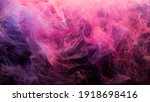 Small photo of Neon smoke. Colorful abstract background. Paint in water splash. Spiritual aura. Glowing bright magenta pink purple steam blend on dark.