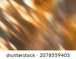 Small photo of Blur glow overlay. Bokeh rays. Sunlight beam glare. Gleam leak. Defocused golden orange black light flecks on dark abstract background.
