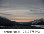 Sun Setting Over the Northern Rocky Mountains and Isolated Alaska Highway in Yukon Territory Canada