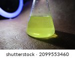 Small photo of Photo of laboratory flasks with poured in them: nitric, phosphoric, sulfuric acid, hydrochloric acid