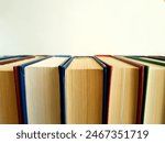 Row of closed hardback books...