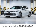 Small photo of St Petersburg, Russia - September 27, 2021: Toyota Camry VIII XV70 front view, three quarters view, headlight off