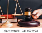 Judge gavel and scales of justice with lawyer book attorney judge hand in court background with wooden table. Law court and judgment concept. Courthouse government theme. Civil Court Criminal Court