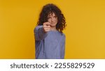 Small photo of Angry aggressive young woman showing fig negative gesture, you dont get it anyway. Rapacious, avaricious, acquisitive. Body language. Refusal fig sign. Greedy avaricious girl on yellow background