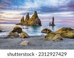 Small photo of Breathtaking view of rock formations Troll Toes on Black beach Reynisfjara near the village of Vik. Location: Reynisfjara Beach, Vik Village, Iceland (Sudurland), Europe