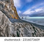 Small photo of Gorgeous landscape with basalt rock formations Troll Toes on Black beach Reynisfjara near the village of Vik. Location: Reynisfjara Beach, Vik Village, Iceland (Sudurland), Europe