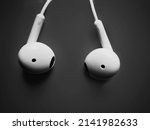 Image of White earphones in Monotone colour.Technology Gadgets Wallpapers for Desktop Pc Download 