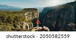 panoramic view of canyon national park in Turkey, banner image nature landscape, hiker woman standing on cliff and overlooking Tazi canyon
