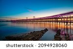 Panoramic view of the ore loading dock of the Rio Tinto mining company in Huelva, Andalusia, Spain. Sunset at the "Muelle del Tinto"