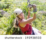 Woman going on a jungle zip line adventure