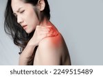 Small photo of Asian beautiful woman is rubbing shoulder with feeling ache from office syndrome or muscle injure