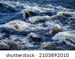 Small photo of An upset river with turmoil, flowing upset water