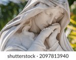 Small photo of old sculpture in a cemetery in Havana, Cuba, Madonna, Crist, angel, hand