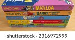 Small photo of Wiltshire, UK - 11th June 2023: A pile showing the spikes of a selection of Roald Dahl children’s paperback fiction books
