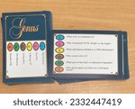Small photo of Wiltshire, UK - 11th July 2023: Trivial Pursuit Genus edition trivia cards displayed on a wooden table