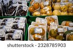 Small photo of Bogor, West Java, Indonesia - May 13, 2022: various fresh organic fruits wrapped in plastic packages in Bogor Trade Mall, Robinson supermarket