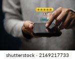 Small photo of Customer Experiences Concept. Happy Client Using Smartphone to Submit Five Star Review Rating for Online Satisfaction Surveys. Positive Feedback on Mobile Phone