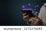 Small photo of Metaverse, Web3 and Blockchain Technology Concepts. Closeup of Hand Using Smartphone for Connect a Community or Playing NFT Virtual Game