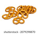 Small photo of A bunch of pretzels. Lots of pieces.Pastries of an interesting unusual shape.Pretzel background.Small pretzels on a white background. Baking for tea. Crispy biscuits.