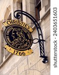 Small photo of Geneva, Switzerland, Europe - 04.2013 : Christie's sign hanging above entrance to saleroom of famous Christie's auction house in the Old Town of the city, Place de la Taconnerie